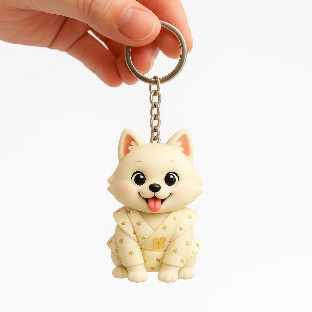 Dog-shaped keychain with a person holding it on a white background