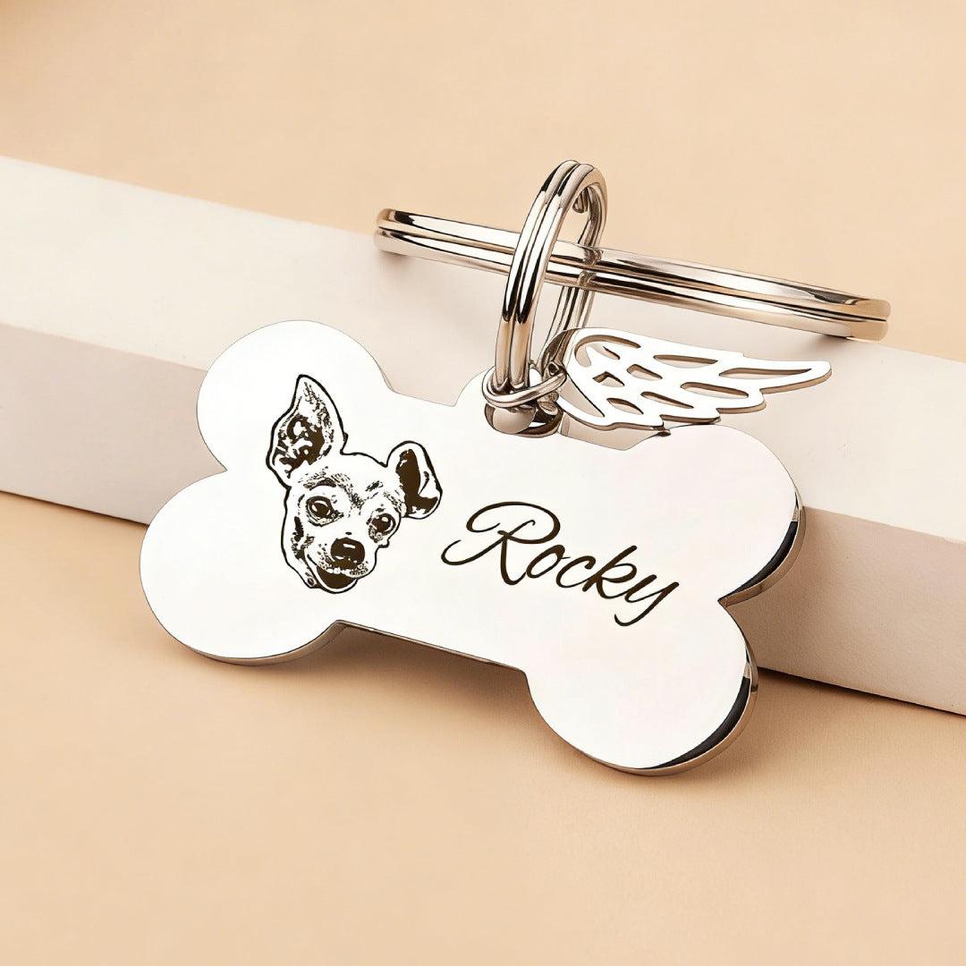 Polished steel engraved dog bone keychain showing the smooth alloy surface and crisp custom lettering