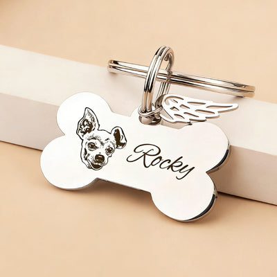 Polished steel engraved dog bone keychain showing the smooth alloy surface and crisp custom lettering